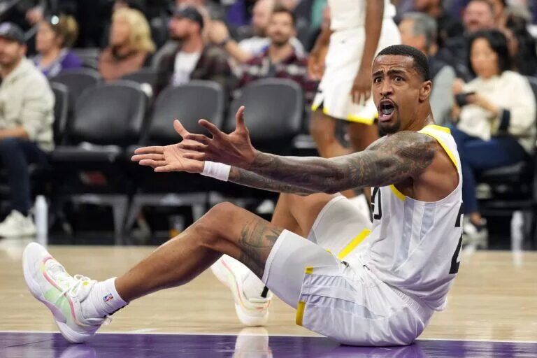 Utah Jazz forward-center John Collins reacts to call during game against Sacramento Kings