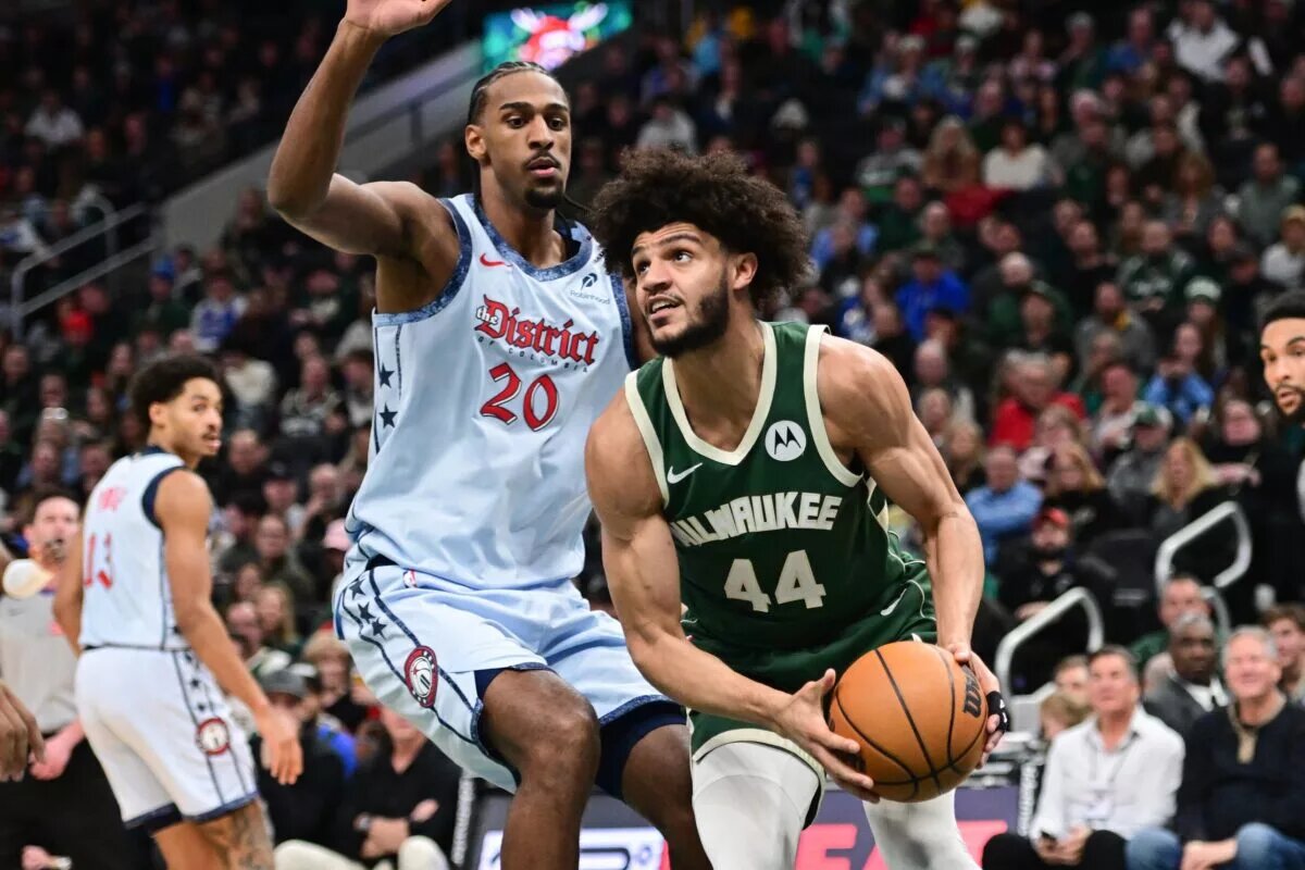 Dec 21, 2024; Milwaukee, Wisconsin, USA; Milwaukee Bucks forward Andre Jackson Jr. (44) drives against Washington Wizards center Alex Sarr (20) in the second quarter at Fiserv Forum.