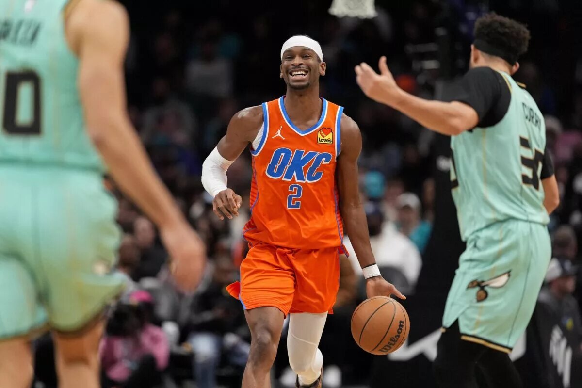 Oklahoma City Thunder guard Shai Gilgeous-Alexander (2) brings the ball up court against the Charlotte Hornets during the second half at Spectrum Center.