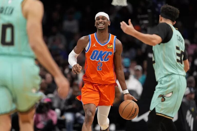 Oklahoma City Thunder guard Shai Gilgeous-Alexander (2) brings the ball up court against the Charlotte Hornets during the second half at Spectrum Center.