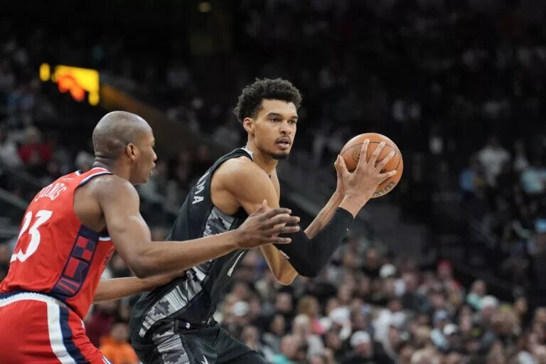 Dec 31, 2024; San Antonio, Texas, USA; San Antonio Spurs center Victor Wembanyama (1) looks to pass the ball against LA Clippers forward Kai Jones (23) in the second half at Frost Bank Center.