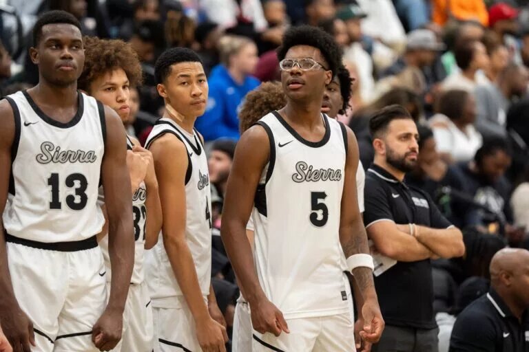 Sierra Canyon’s Bryce James (5), the son of NBA player LeBron James, stands with his teammates by the bench before the game between Sierra Canyon and Bartlett High School during Memphis Hoopfest in Eads, Tenn., on Friday, January 3, 2025.