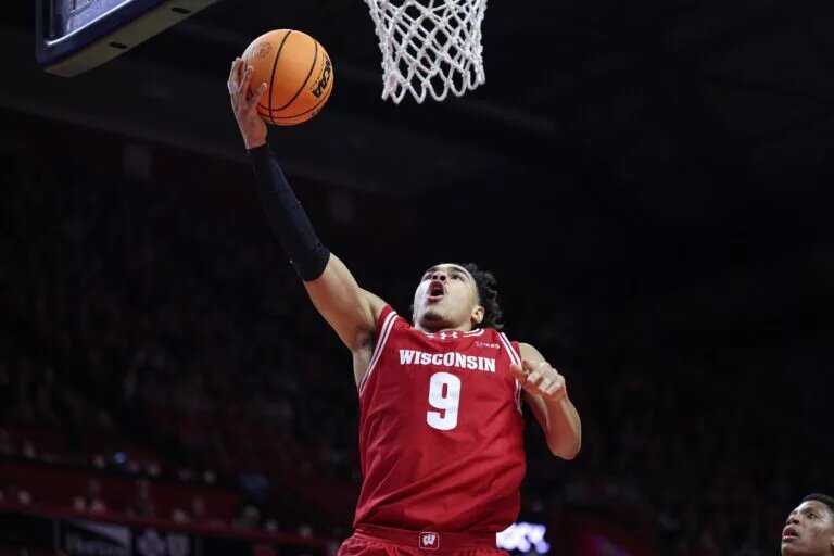 Wisconsin Badgers guard John Tonje (9) goes to the basket during the first half against the Rutgers Scarlet Knights at Jersey Mike's Arena.
