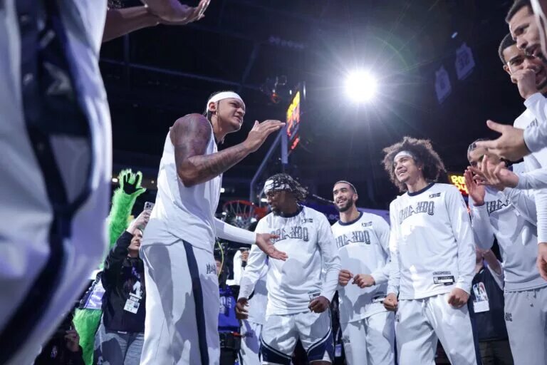 Orlando Magic forward Paolo Banchero in the center of the huddle during player intros