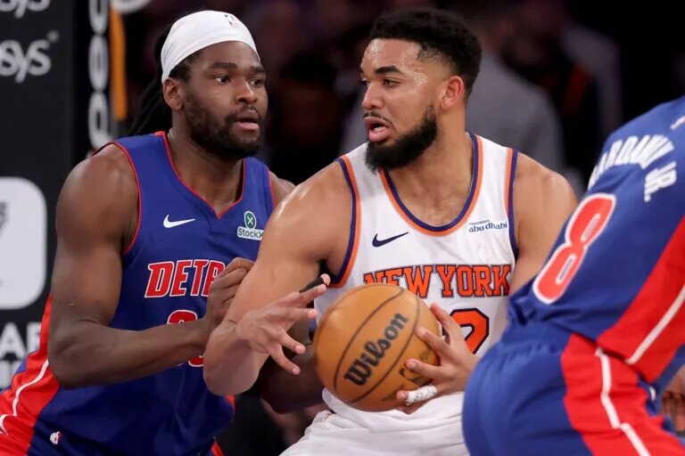 Jan 13, 2025; New York, New York, USA; New York Knicks center Karl-Anthony Towns (32) controls the ball against Detroit Pistons center Isaiah Stewart (28) during the third quarter at Madison Square Garden.