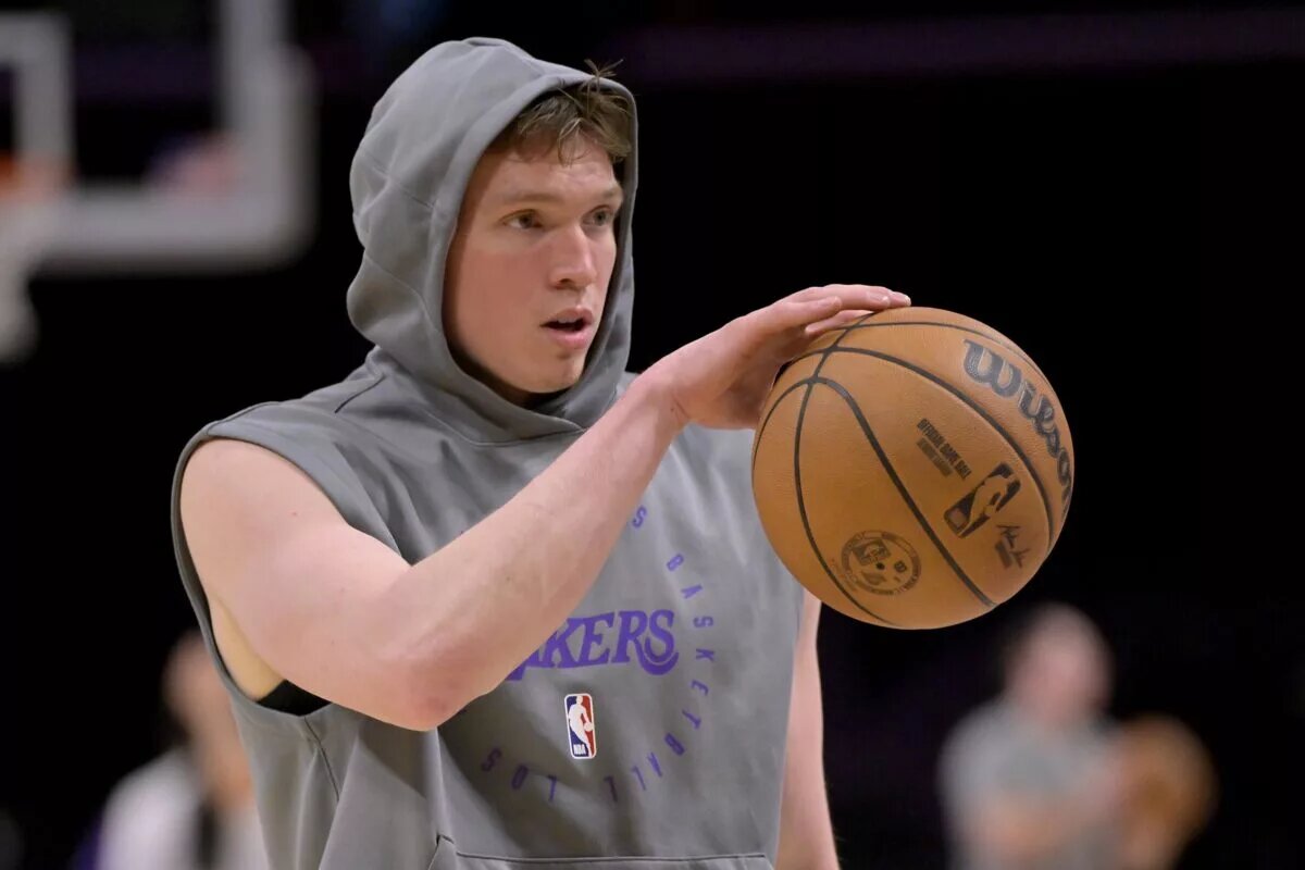 Jan 17, 2025; Los Angeles, California, USA; Los Angeles Lakers guard Dalton Knecht (4) warms up prior to the game against the Brooklyn Nets at Crypto.com Arena.