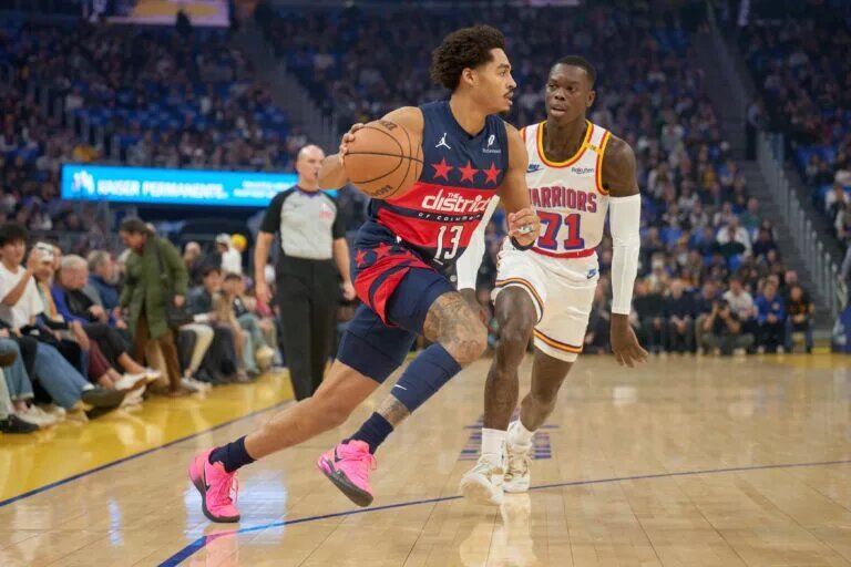 Jan 18, 2025; San Francisco, California, USA; Washington Wizards guard Jordan Poole (13) drives with the ball against Golden State Warriors guard Dennis Schroder (71) during the first quarter at Chase Center. Mandatory Credit: Robert Edwards-Imagn Images