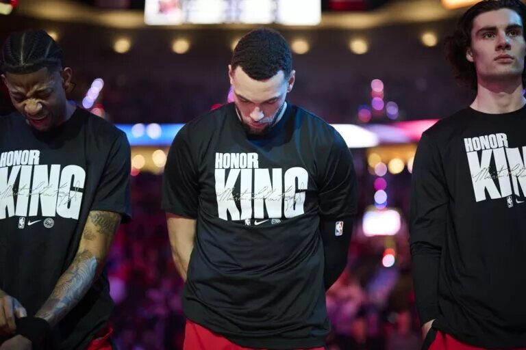 Chicago Bulls guard Zach LaVine between teammates Dalen Terry and Josh Giddey