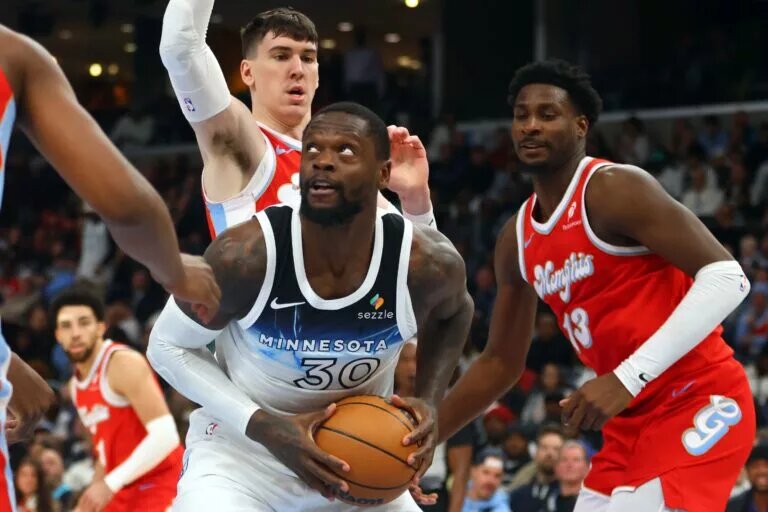 Minnesota Timberwolves forward Julius Randle in a crowd of Memphis Grizzlies players