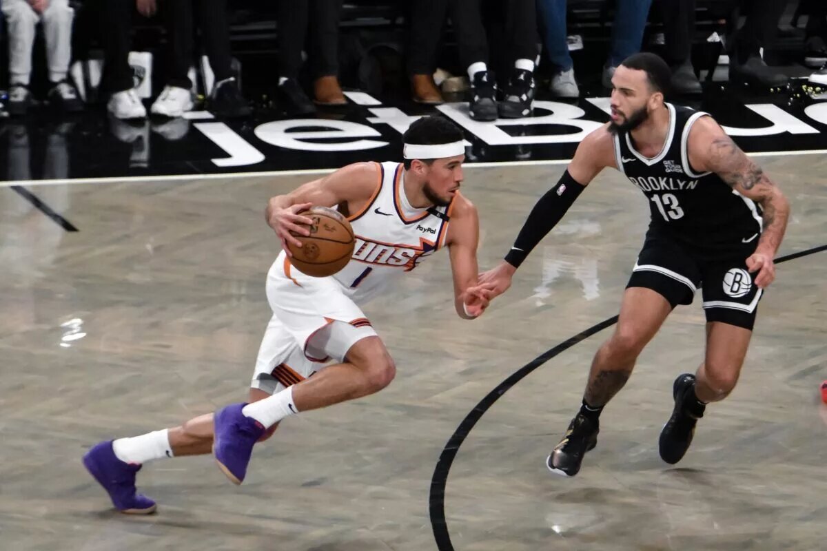 Phoenix Suns guard Devin Booker drives against Brooklyn Nets