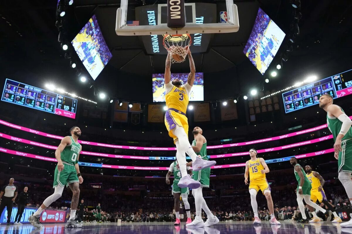 Jan 23, 2025; Los Angeles, California, USA; Los Angeles Lakers forward Anthony Davis (3) dunks the ball against the Boston Celtics in the first half at Crypto.com Arena. Mandatory Credit: Kirby Lee-Imagn Images