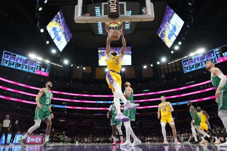 Jan 23, 2025; Los Angeles, California, USA; Los Angeles Lakers forward Anthony Davis (3) dunks the ball against the Boston Celtics in the first half at Crypto.com Arena. Mandatory Credit: Kirby Lee-Imagn Images