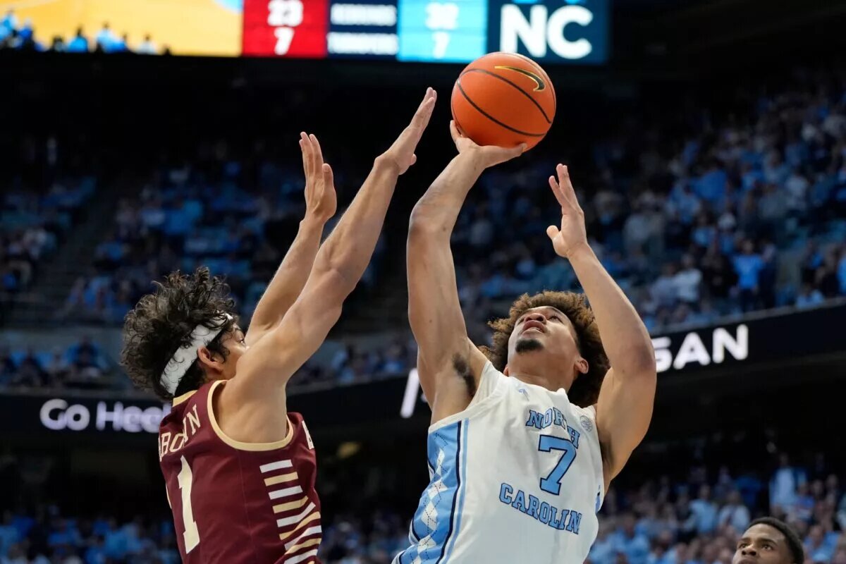 North Carolina Tar Heels guard Seth Trimble (7) shoots as Boston College Eagles guard Dion Brown (1) defends in the second half at Dean E. Smith Center.