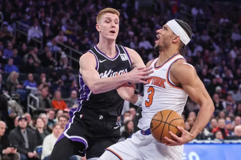 Jan 25, 2025; New York, New York, USA; New York Knicks guard Josh Hart (3) controls the ball against Sacramento Kings guard Kevin Huerter (9) in the second quarter at Madison Square Garden.