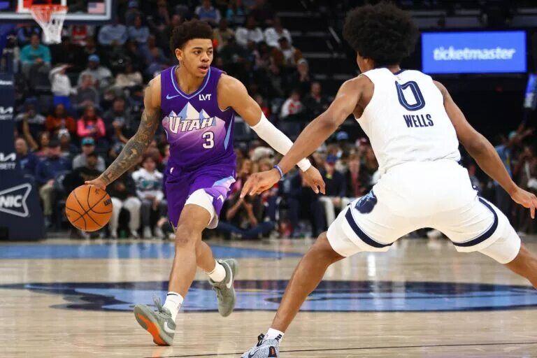Jan 25, 2025; Memphis, Tennessee, USA; Utah Jazz guard Keyonte George (3) dribbles the ball against Memphis Grizzlies forward Jaylen Wells (0) during the third quarter at FedExForum.