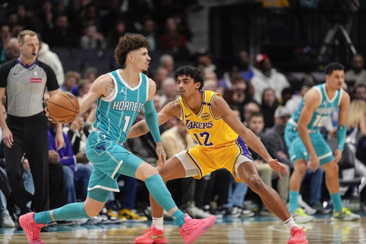 Charlotte Hornets point guard LaMelo Ball looks to make a pass against Los Angeles Lakers defense