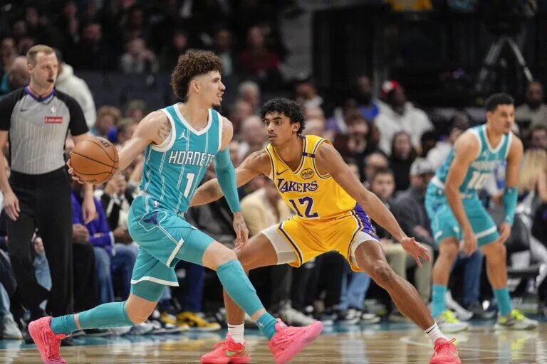 Charlotte Hornets point guard LaMelo Ball looks to make a pass against Los Angeles Lakers defense