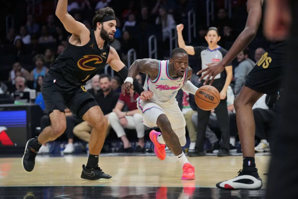 Jan 29, 2025; Miami, Florida, USA; Miami Heat guard Terry Rozier (2) drives to the basket and gets fouled by Cleveland Cavaliers guard Max Strus (1) during the second half at Kaseya Center.