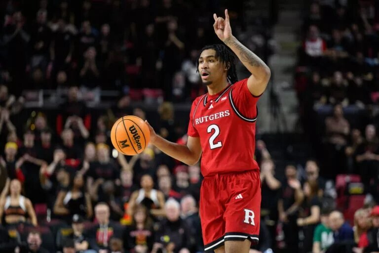 Rutgers Scarlet Knights guard Dylan Harper (2) handles the basketball