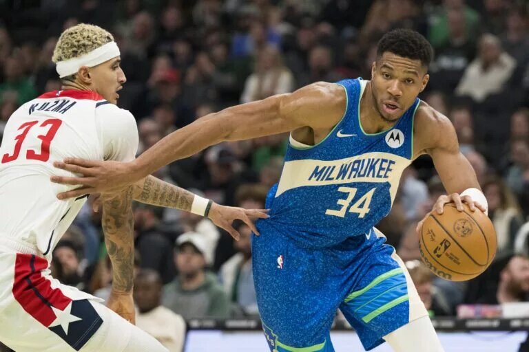 Washington Wizards trade candidate Kyle Kuzma attempts to guard Milwaukee Bucks forward Giannis Antetokounmpo
