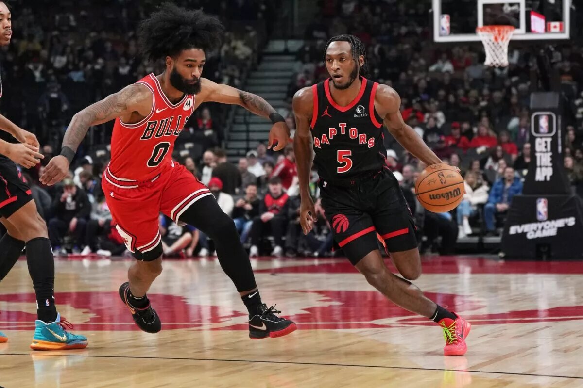 Toronto Raptors guard Immanuel Quickley attacks Chicago Bulls guard Coby White off-the-dribble