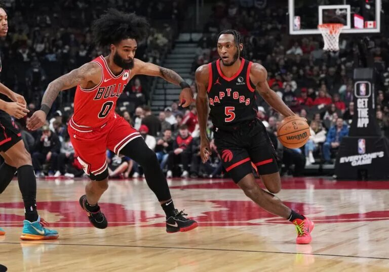Toronto Raptors guard Immanuel Quickley attacks Chicago Bulls guard Coby White off-the-dribble