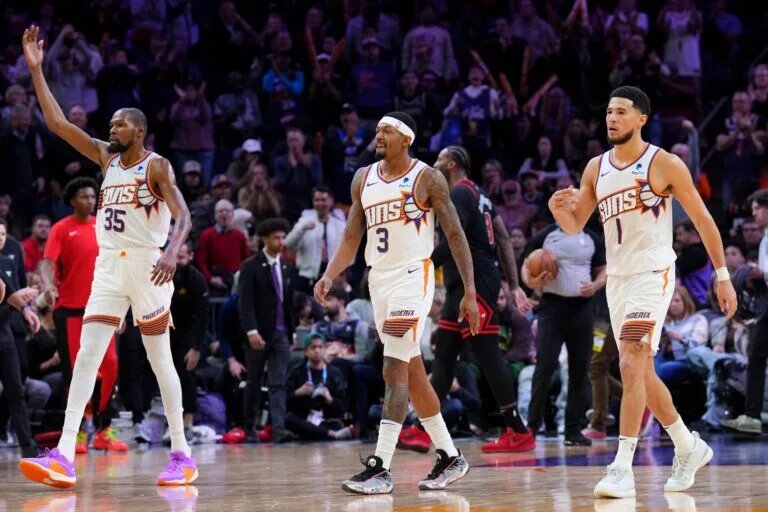 Phoenix Suns forward Kevin Durant (35) and Phoenix Suns guard Bradley Beal (3) and Phoenix Suns guard Devin Booker