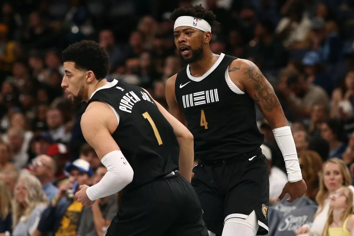 Apr 12, 2024; Memphis, Tennessee, USA; Memphis Grizzlies guard Jordan Goodwin (4) reacts with Memphis Grizzlies guard Scotty Pippen Jr. (1) during the second half against the Los Angeles Lakers at FedExForum. Mandatory Credit: Petre Thomas-USA TODAY Sports