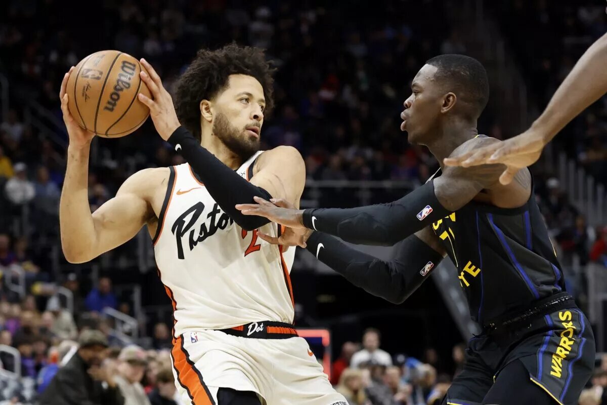 Jan 9, 2025; Detroit, Michigan, USA; Detroit Pistons guard Cade Cunningham (2) is defended by Golden State Warriors guard Dennis Schroder (71) in the first half at Little Caesars Arena. Mandatory Credit: Rick Osentoski-Imagn Images