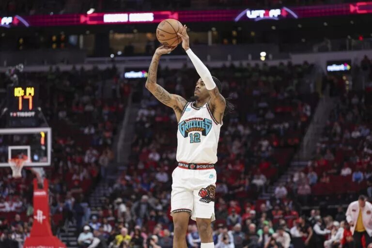 Memphis Grizzlies guard Ja Morant (12) shoots the ball during the first quarter against the Houston Rockets at Toyota Center.