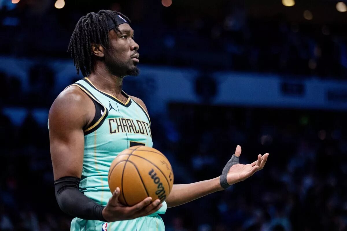 Jan 24, 2025; Charlotte, North Carolina, USA; Charlotte Hornets center Mark Williams (5) reacts after a foul against the Portland Trail Blazers during the third quarter at Spectrum Center. Mandatory Credit: Scott Kinser-Imagn Images