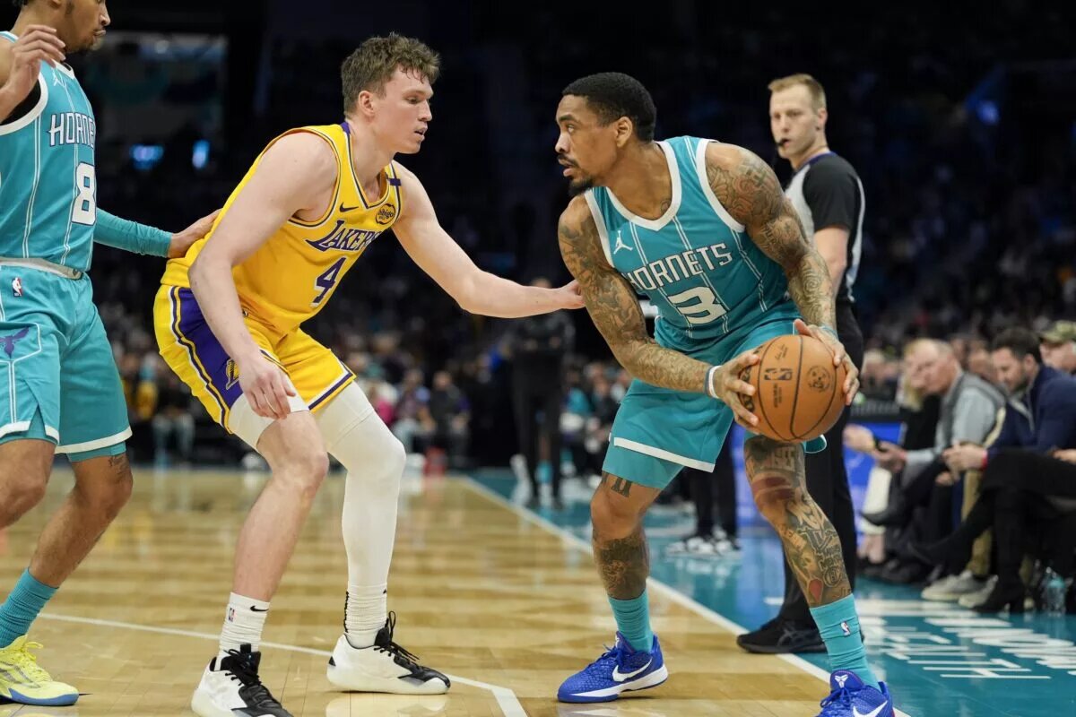 Jan 27, 2025; Charlotte, North Carolina, USA; Charlotte Hornets guard DaQuan Jeffries (3) handles the ball against Los Angeles Lakers guard Dalton Knecht (4) during the second half at the Spectrum Center.
