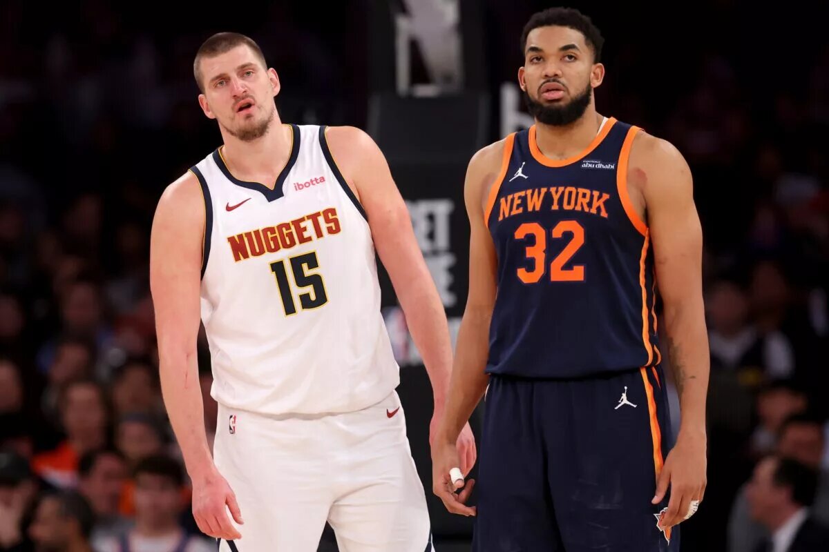 Denver Nuggets center Nikola Jokic (15) and New York Knicks center Karl-Anthony Towns (32) react during the fourth quarter at Madison Square Garden.