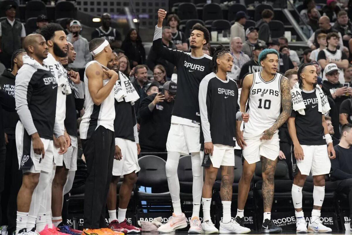 Jan 31, 2025; San Antonio, Texas, USA; San Antonio Spurs center Victor Wembanyama (1) and teammates react to a victory over the Milwaukee Bucks at Frost Bank Center.
