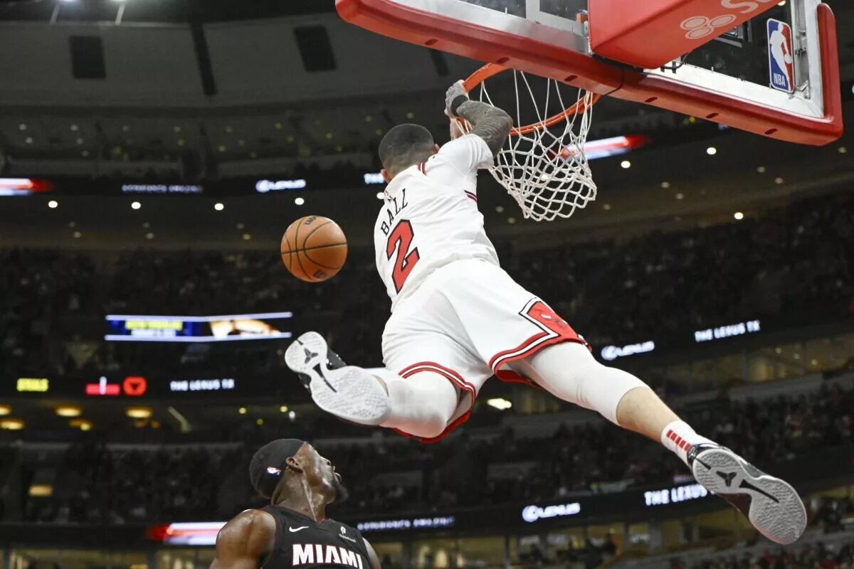 Feb 4, 2025; Chicago, Illinois, USA; Chicago Bulls guard Lonzo Ball (2) misses a dunk against the Miami Heat during the first half at United Center.