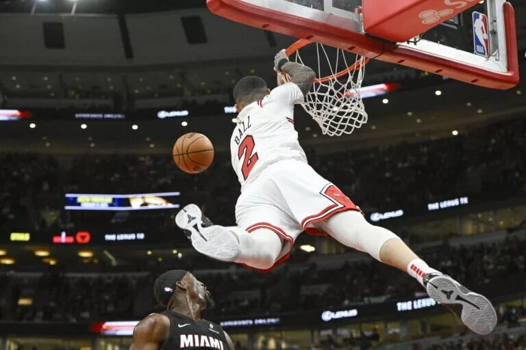 Feb 4, 2025; Chicago, Illinois, USA; Chicago Bulls guard Lonzo Ball (2) misses a dunk against the Miami Heat during the first half at United Center.