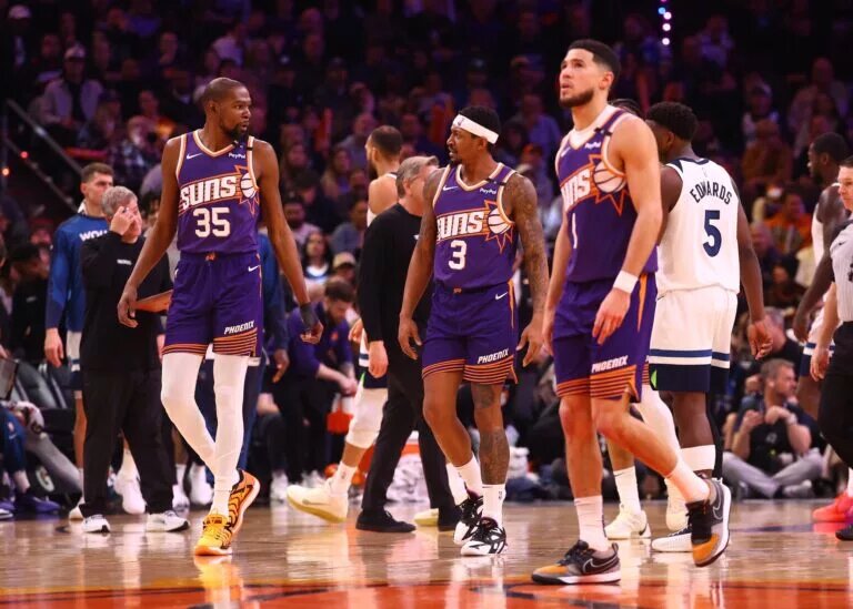 Phoenix Suns forward Kevin Durant (35) with guard Bradley Beal (3) and Devin Booker (1) against the Minnesota Timberwolves at Footprint Center.