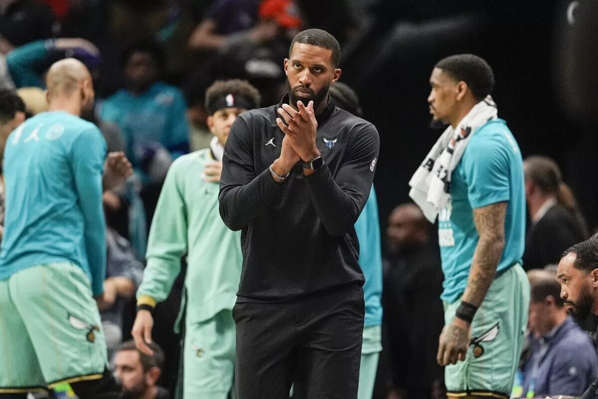 Feb 7, 2025; Charlotte, North Carolina, USA; Charlotte Hornets head coach Charles Lee applauds his teams efforts against the San Antonio Spurs during the second half at Spectrum Center. Mandatory Credit: Jim Dedmon-Imagn Images
