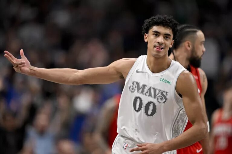 Feb 8, 2025; Dallas, Texas, USA; Dallas Mavericks guard Max Christie (00) celebrates after he makes a three point basket against the Houston Rockets during the second half at the American Airlines Center.