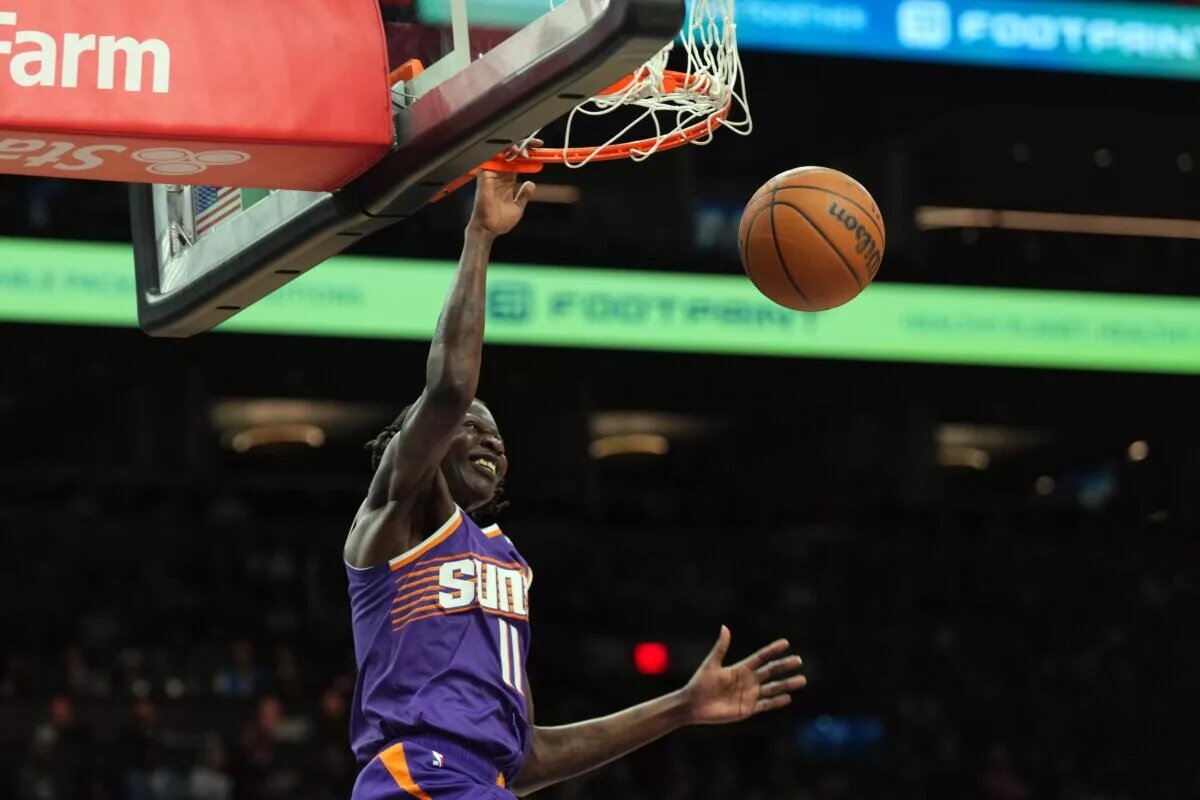 Phoenix Suns center Bol Bol (11) dunks against the Denver Nuggets during the first half at Footprint Center.
