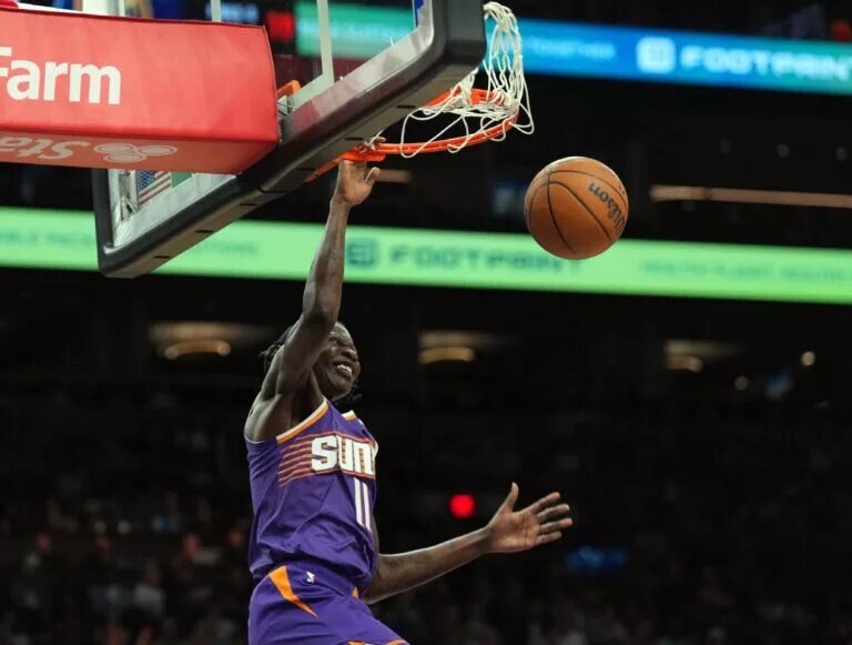 Phoenix Suns center Bol Bol (11) dunks against the Denver Nuggets during the first half at Footprint Center.