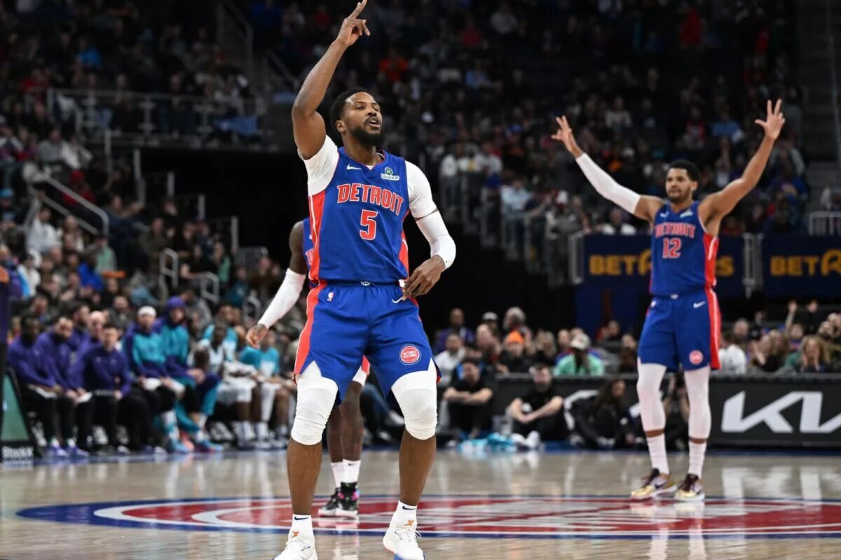 Detroit Pistons guard Malik Beasley (5) celebrates after making a three-point shot against the Charlotte Hornets in the first quarter at Little Caesars Arena.