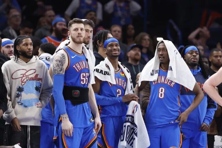 Oklahoma City Thunder guard Isaiah Joe (11), center Isaiah Hartenstein (55), forward Chet Holmgren (7), guard Shai Gilgeous-Alexander (2), forward Jalen Williams (8) and guard Luguentz Dort (5) watch the end of a game against the New Orleans Pelicans at Paycom Center.