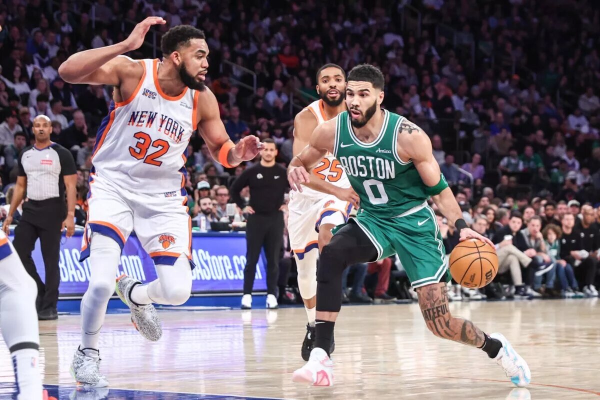 Feb 8, 2025; New York, New York, USA; Boston Celtics forward Jayson Tatum (0) and New York Knicks center Karl-Anthony Towns (32) at Madison Square Garden. Mandatory Credit: Wendell Cruz-Imagn Images