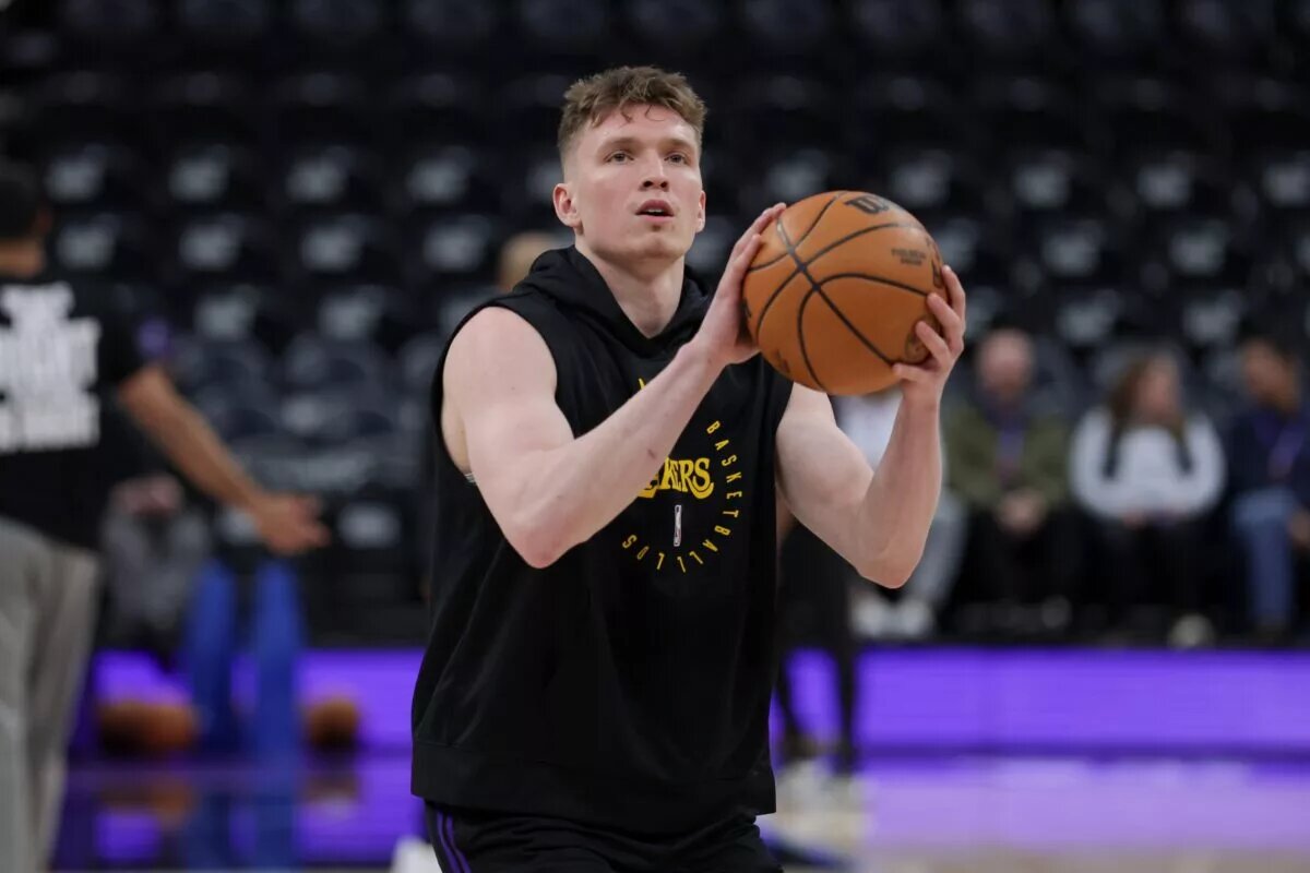 Los Angeles Lakers guard Dalton Knecht (4) shoots before a game against the Utah Jazz at Delta Center.
