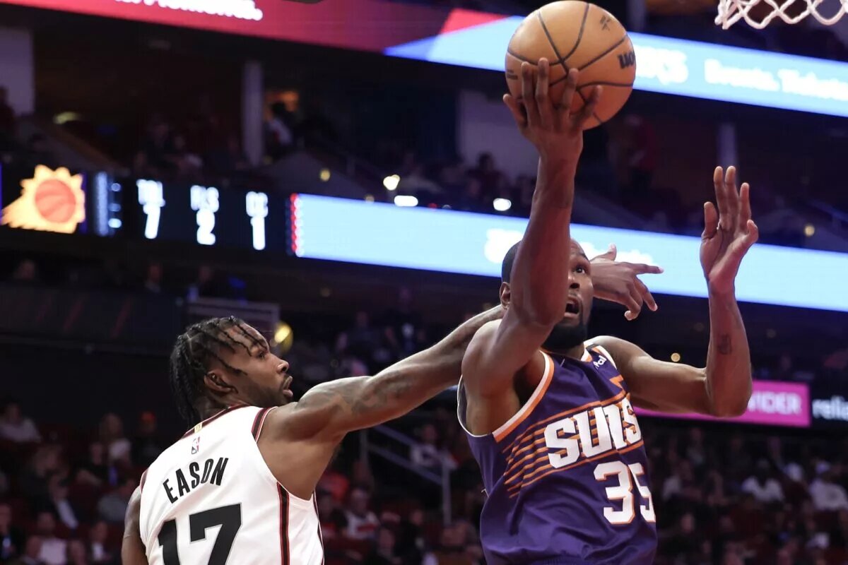 Feb 12, 2025; Houston, Texas, USA; Phoenix Suns forward Kevin Durant (35) drives against Houston Rockets forward Tari Eason (17) in the first quarter at Toyota Center. Mandatory Credit: Thomas Shea-Imagn Images