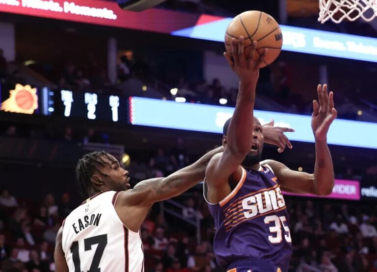 Feb 12, 2025; Houston, Texas, USA; Phoenix Suns forward Kevin Durant (35) drives against Houston Rockets forward Tari Eason (17) in the first quarter at Toyota Center. Mandatory Credit: Thomas Shea-Imagn Images