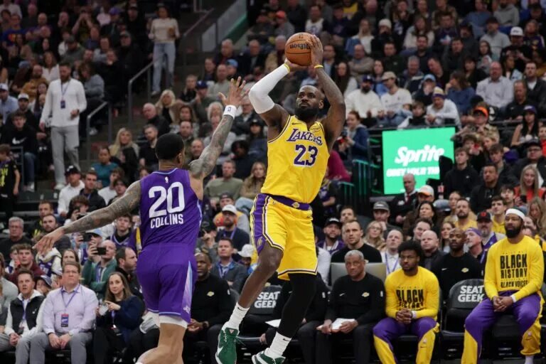 Feb 12, 2025; Salt Lake City, Utah, USA; Los Angeles Lakers forward LeBron James (23) shoots over Utah Jazz forward John Collins (20) during the second quarter at Delta Center. Mandatory Credit: Chris Nicoll-Imagn Images