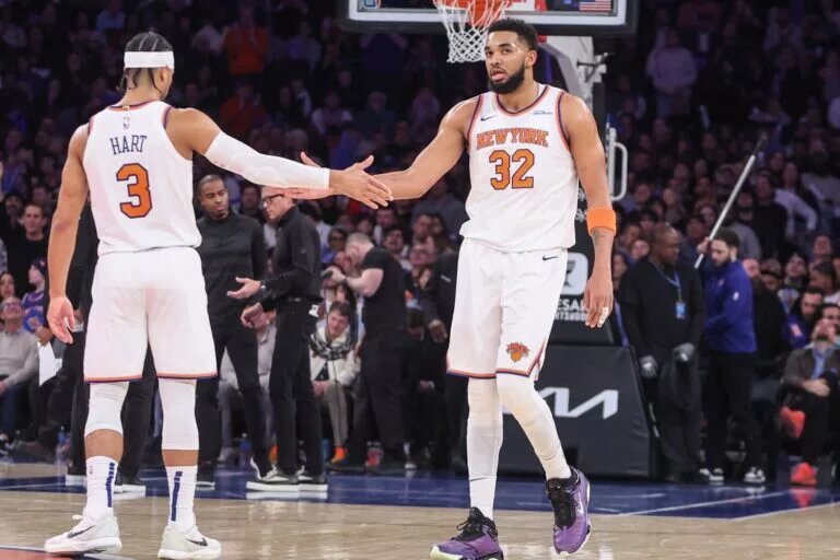 New York Knicks center Karl-Anthony Towns (32) is greeted by guard Josh Hart