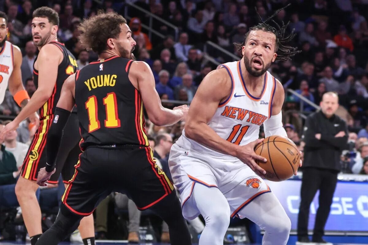 New York Knicks guard Jalen Brunson (11) looks to post up against Atlanta Hawks guard Trae Young (11) in the second quarter at Madison Square Garden.